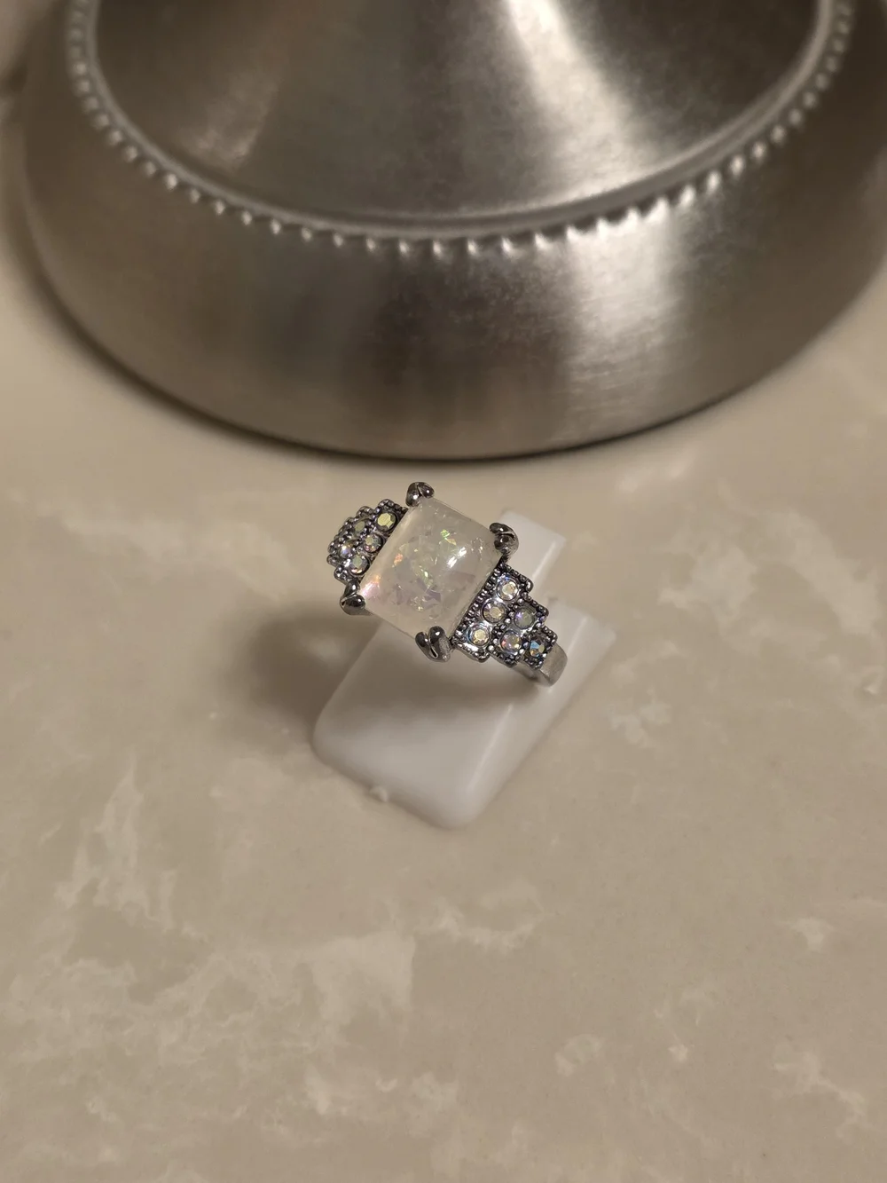 Opal Centerpiece Silver Ring with Sparkling Accent Stones